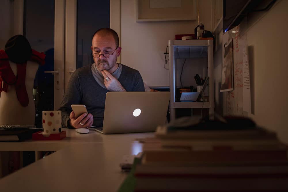 man on dual screen time