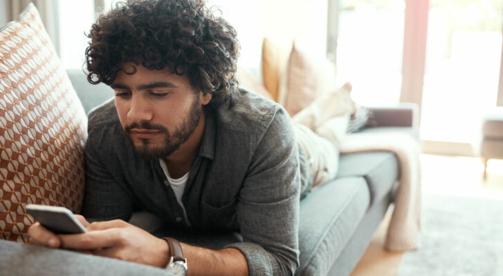 man on phone doing lots of screen time
