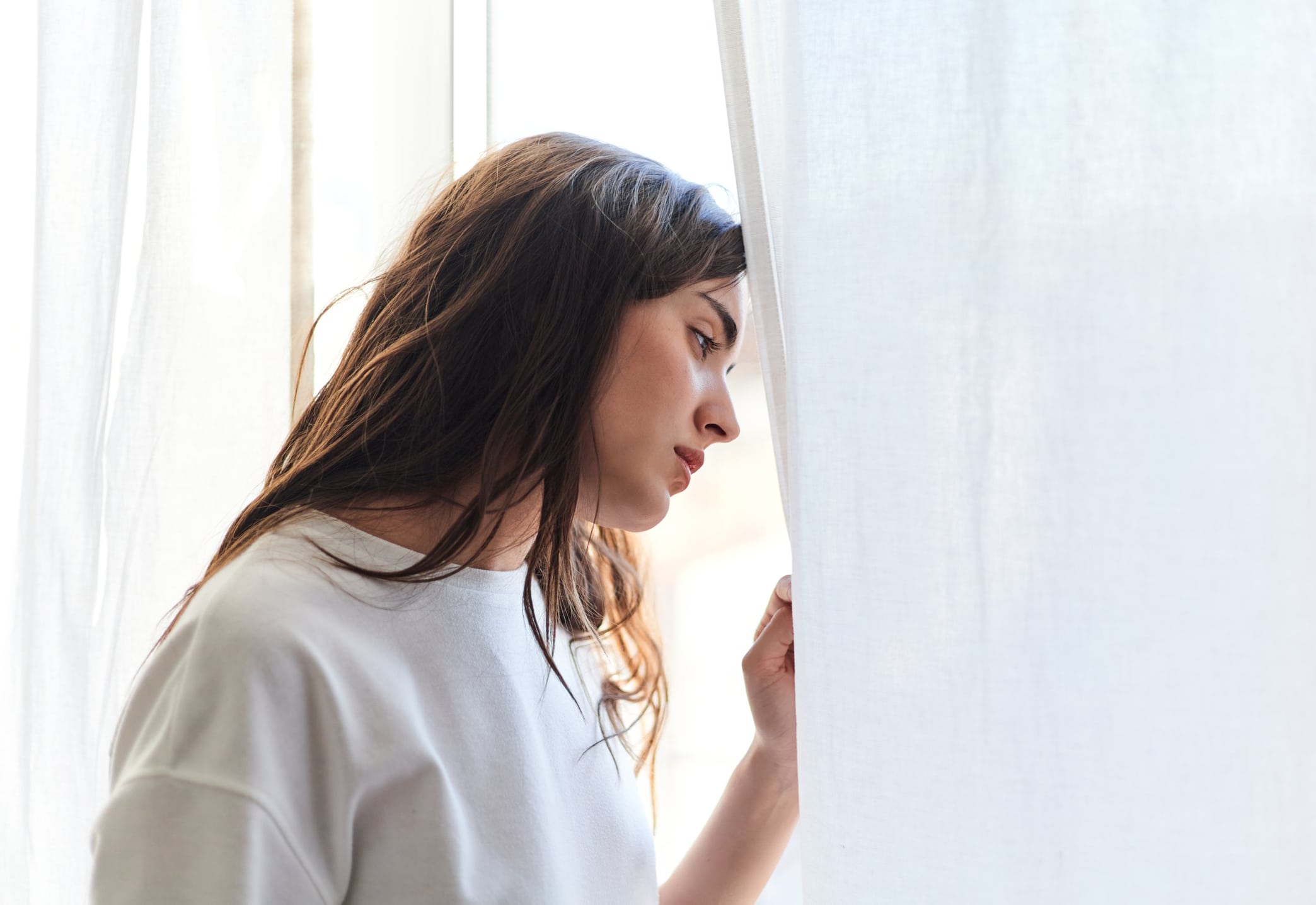 Woman looking out window