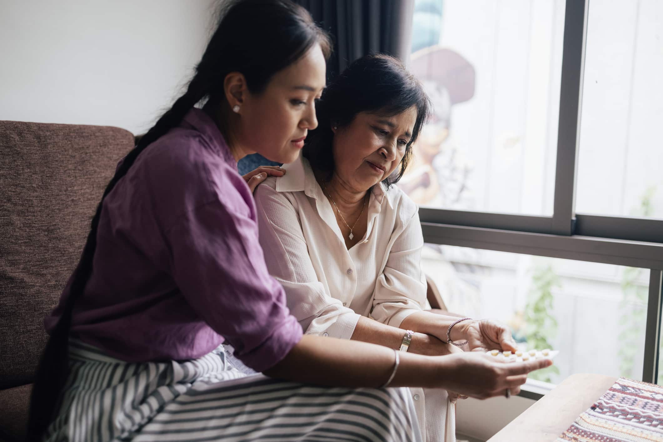 Daughter helping depressed mother 