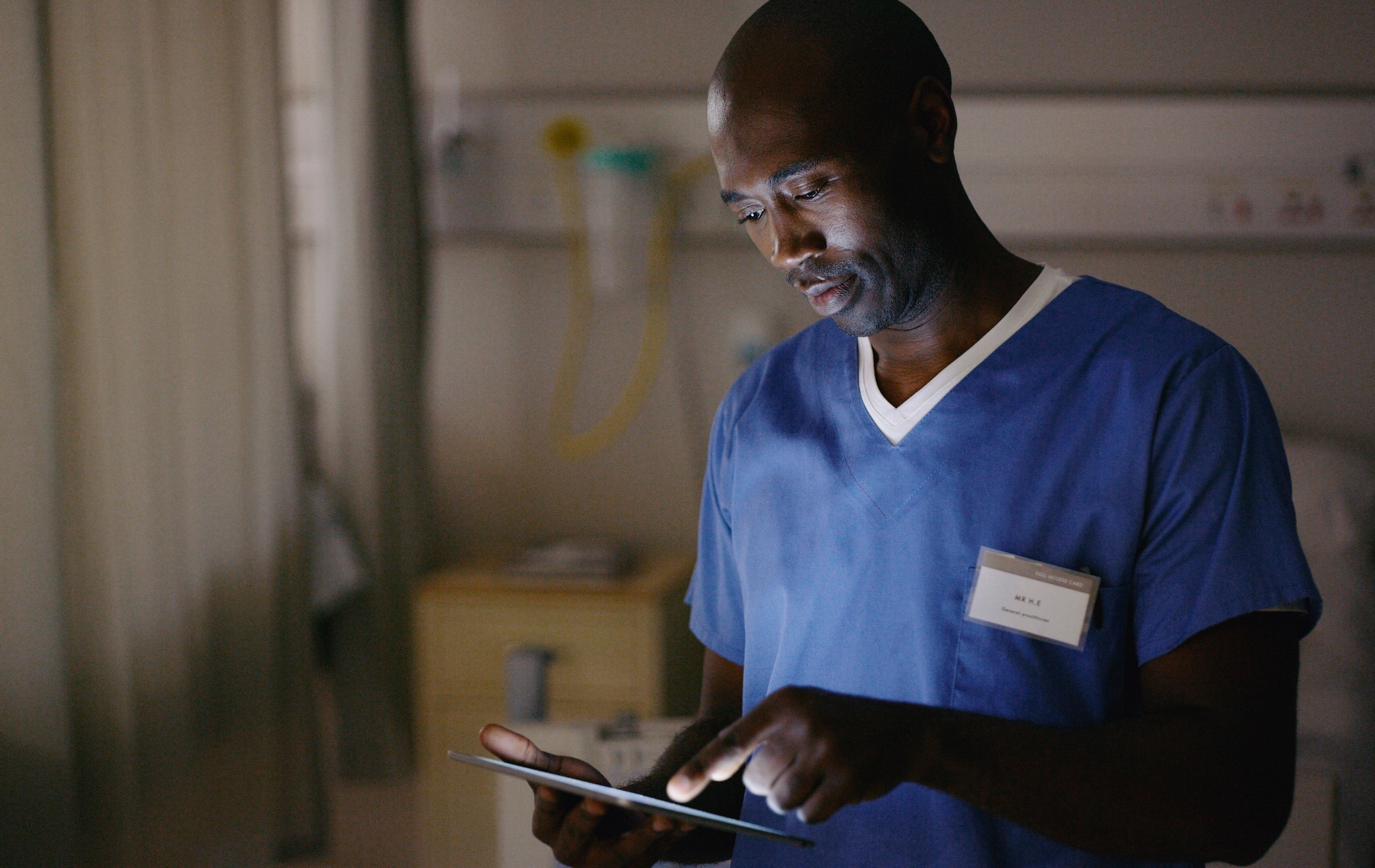 Nurse reviewing chart data of patient