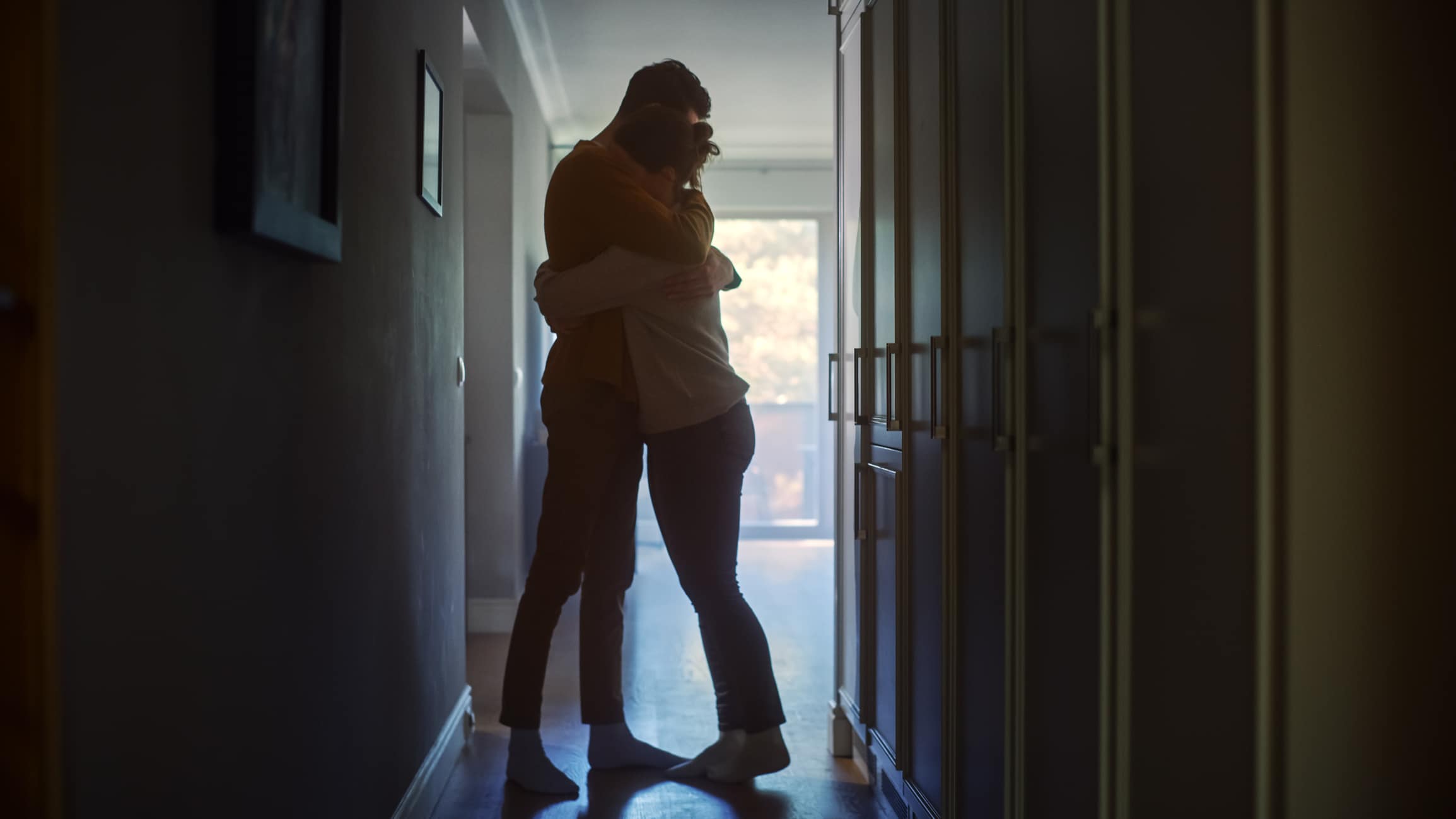 couple hugging at home