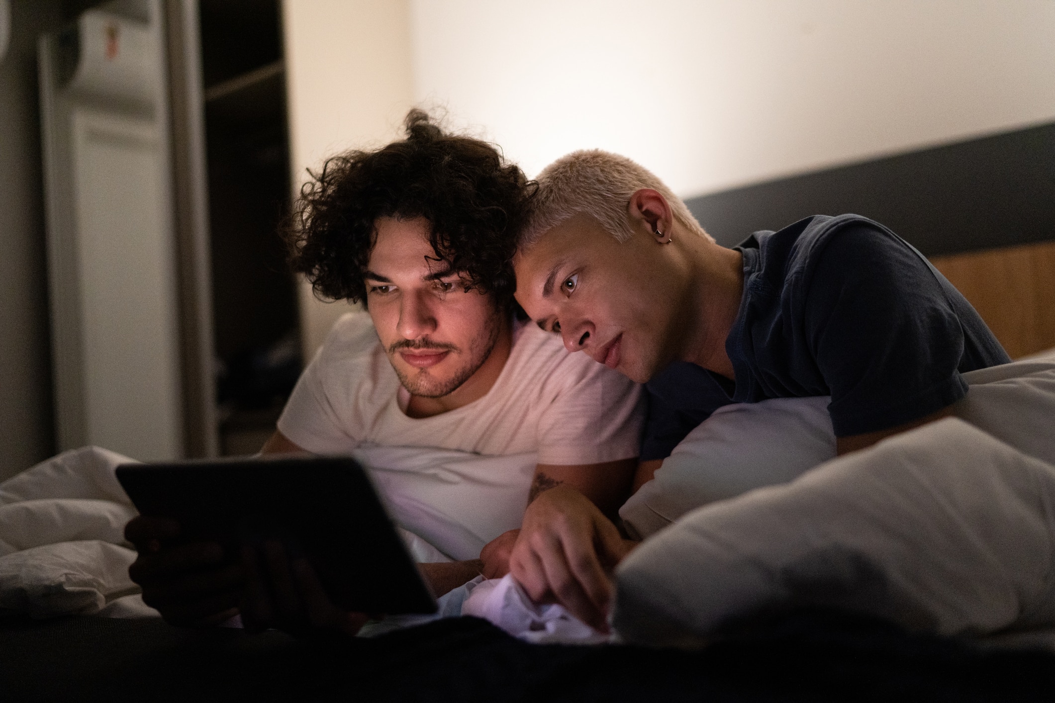 two men looking up resources online