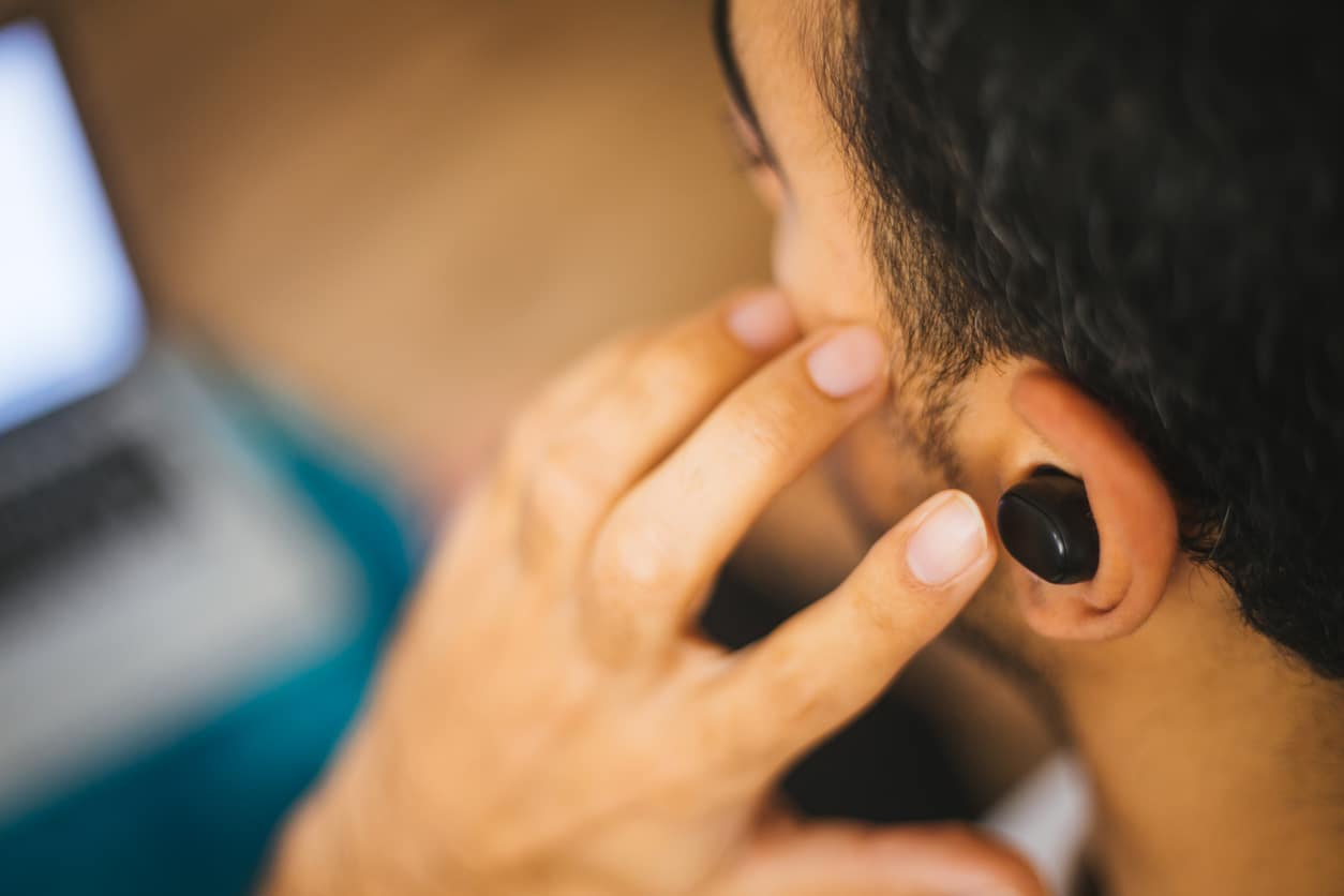 man listening to podcast