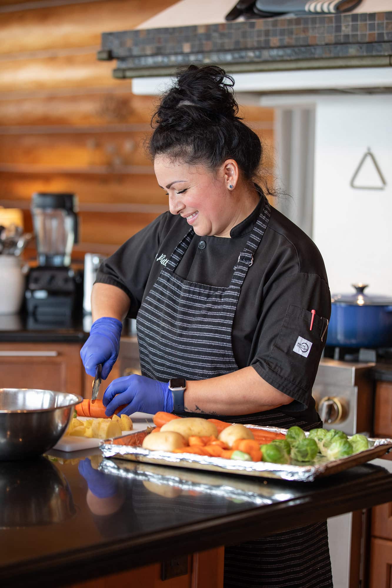 Patty Duran, chef at Meadows Malibu, cutting vegetables.